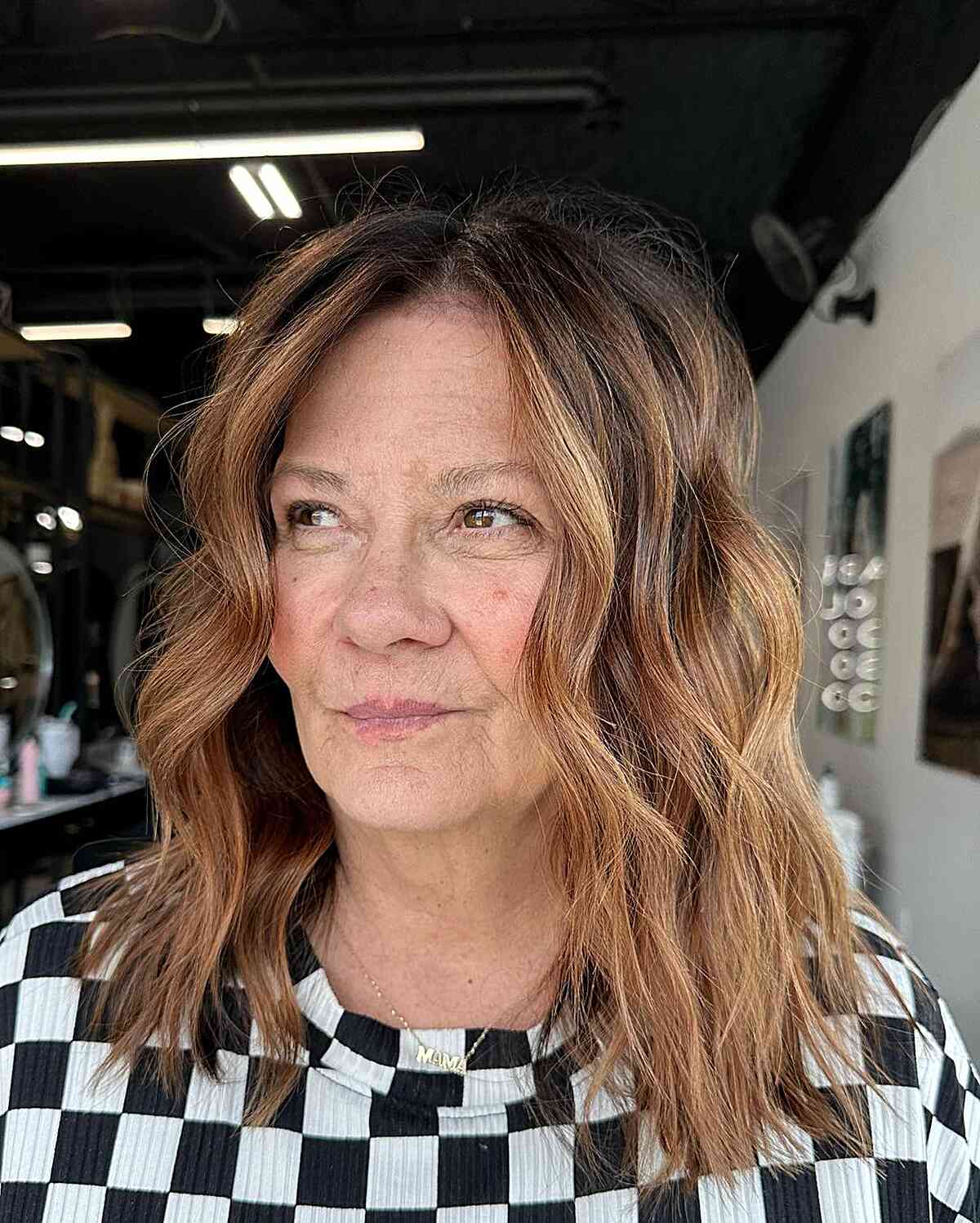 Fall Cinnamon Brown Highlights and Mid-Length Beach Waves for Women Aged 50