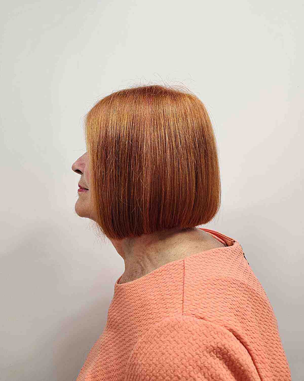 Fall-Inspired Short Haircut with Natural Ginger Color for 60-year-olds