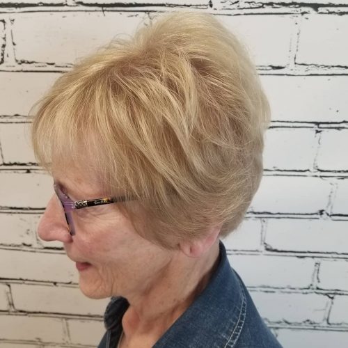 Feminine Feathered Bob with Bangs for a 50 year old with glasses