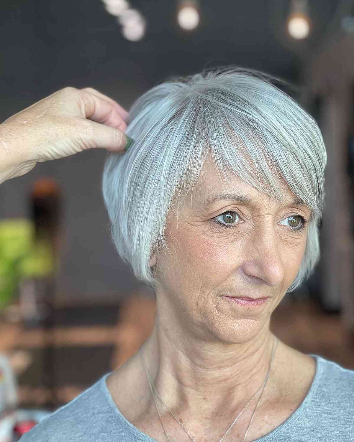 Feathered Bob with Side-Swept Bangs for Women Aged 60