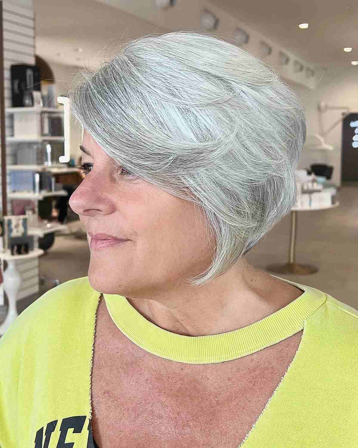Feathered Silver Bob with Side-Swept Bangs for Women 50 and Over
