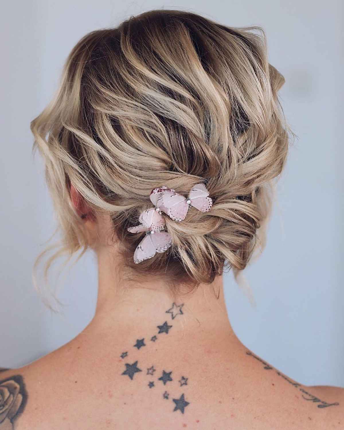 Feathered updo for short bob