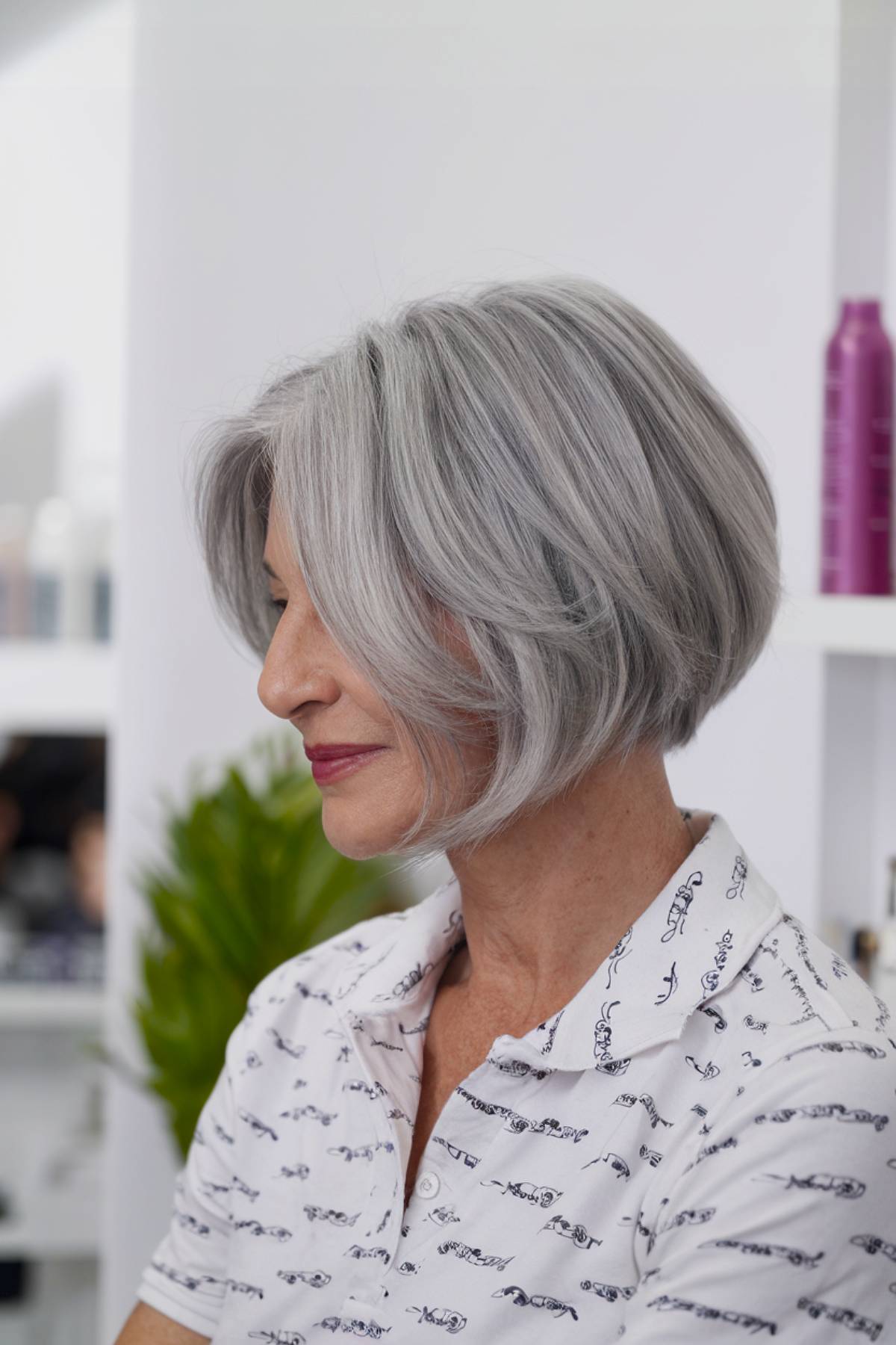 A lightweight, feathered angled bob with soft layers, creating a delicate and airy effect for senior women