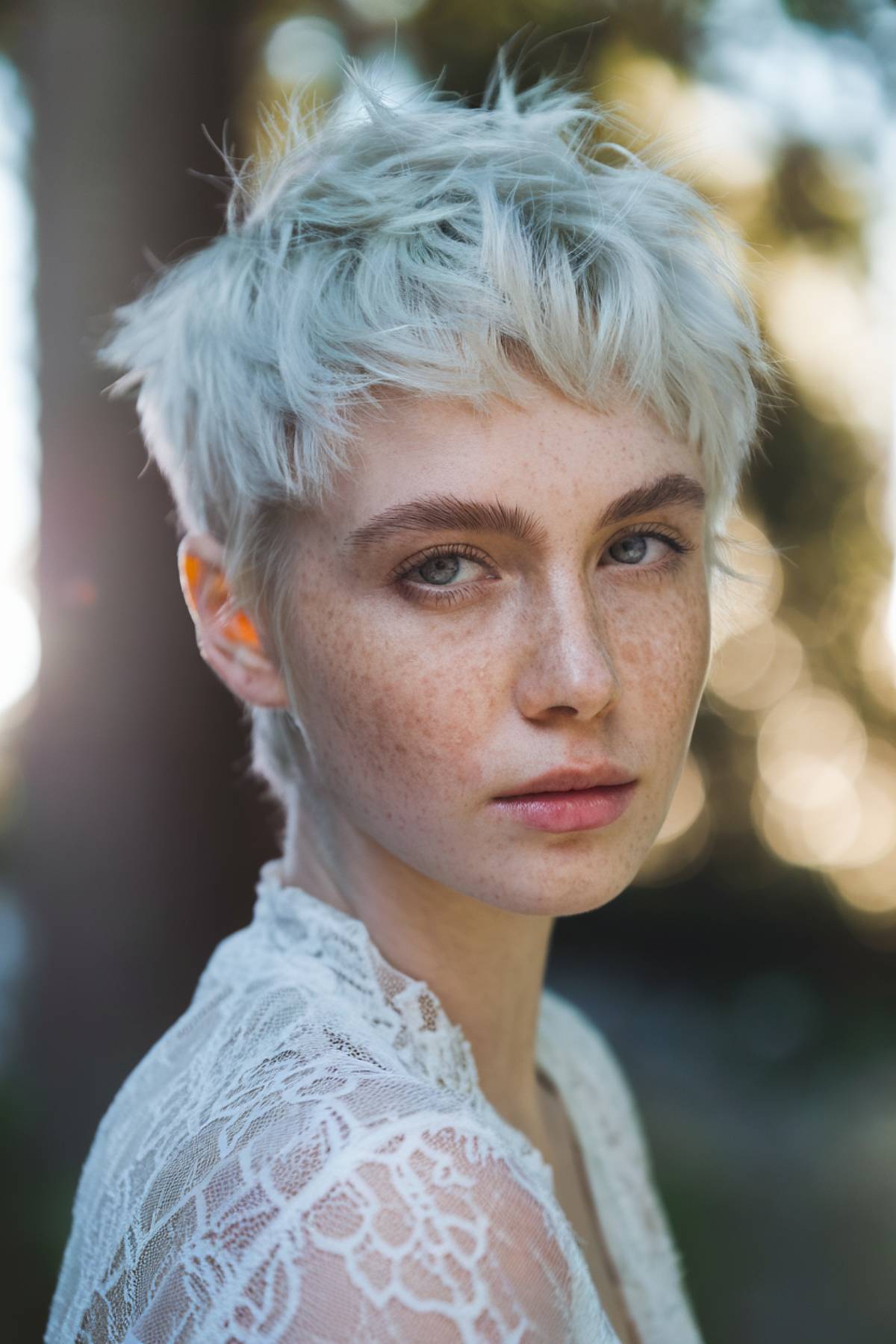 Soft, airy featherlite pixie cut with delicate layers for a light, effortless look