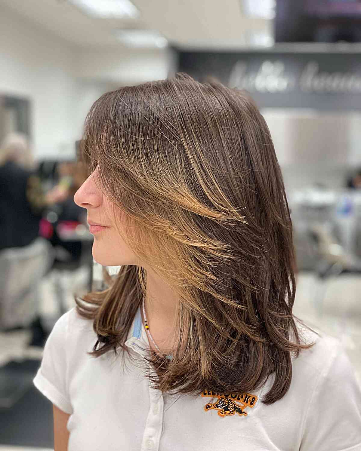 Feathery Layered Straight Lob with Blonde Highlights