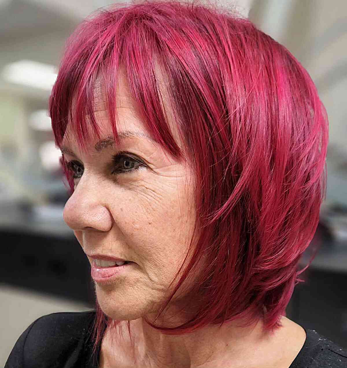 Feminine Vivid Cherry Red Hair Color for Women Aged 50
