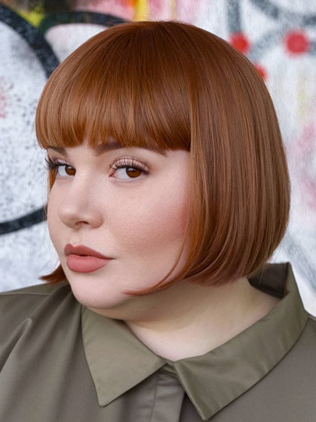 Sleek structured bob haircut with full bangs for round faces and double chins