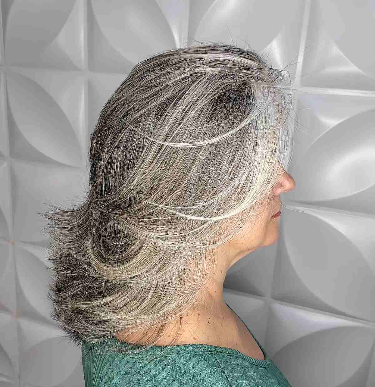 Flattering Feathered Lob with Wispy Ends for Women Over 50 with Thick Hair