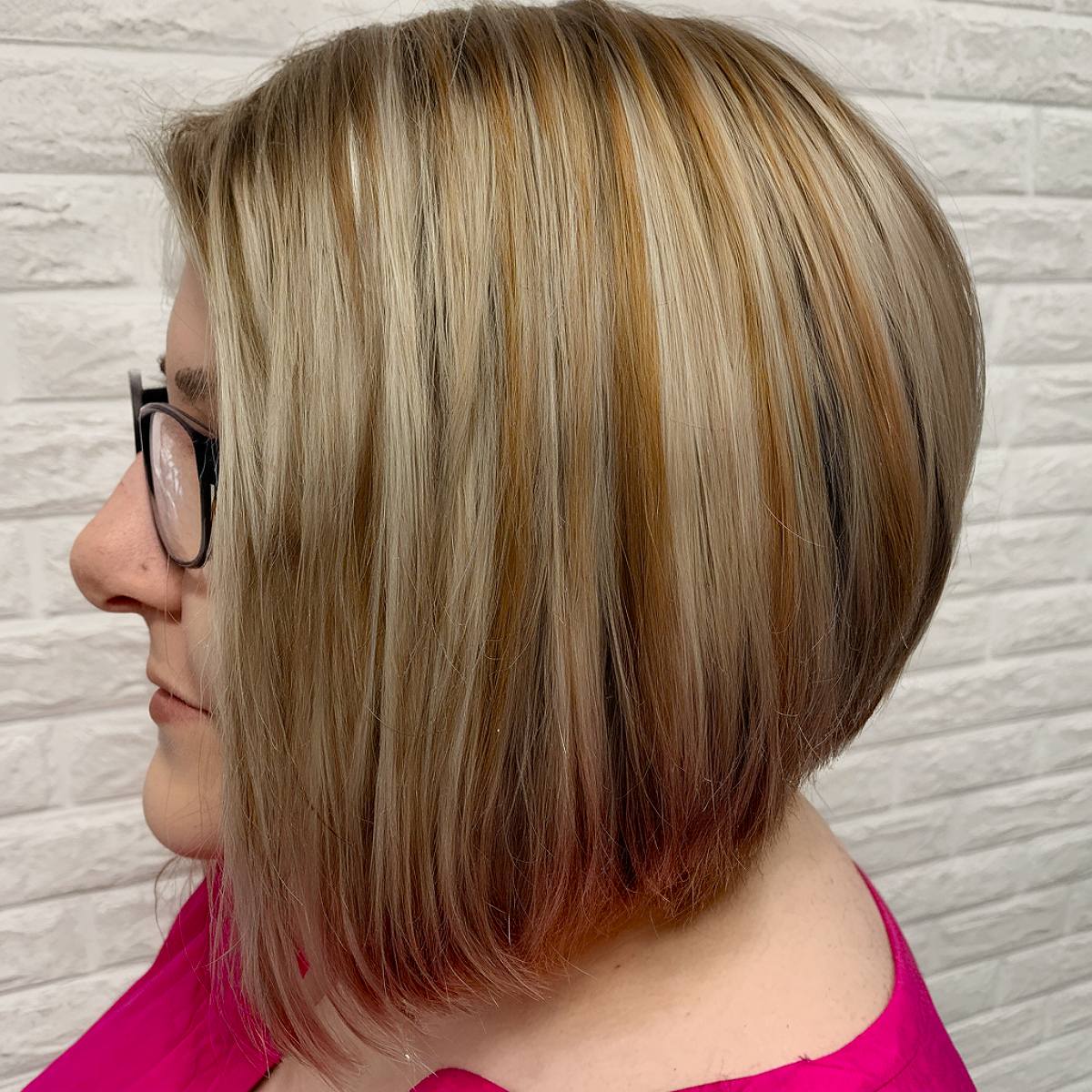 Angled bob haircut for plus-size women with layered taper