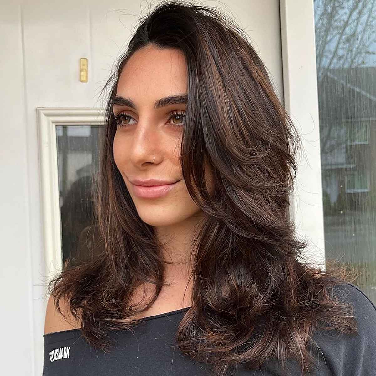 Flowing long layers with a side-part of medium-length hair