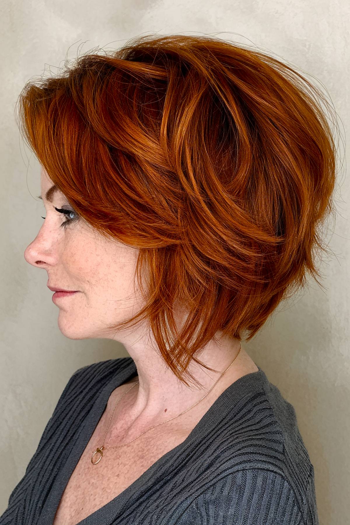 A bold foxybob with rich copper tones and tousled layers, giving a voluminous and edgy look