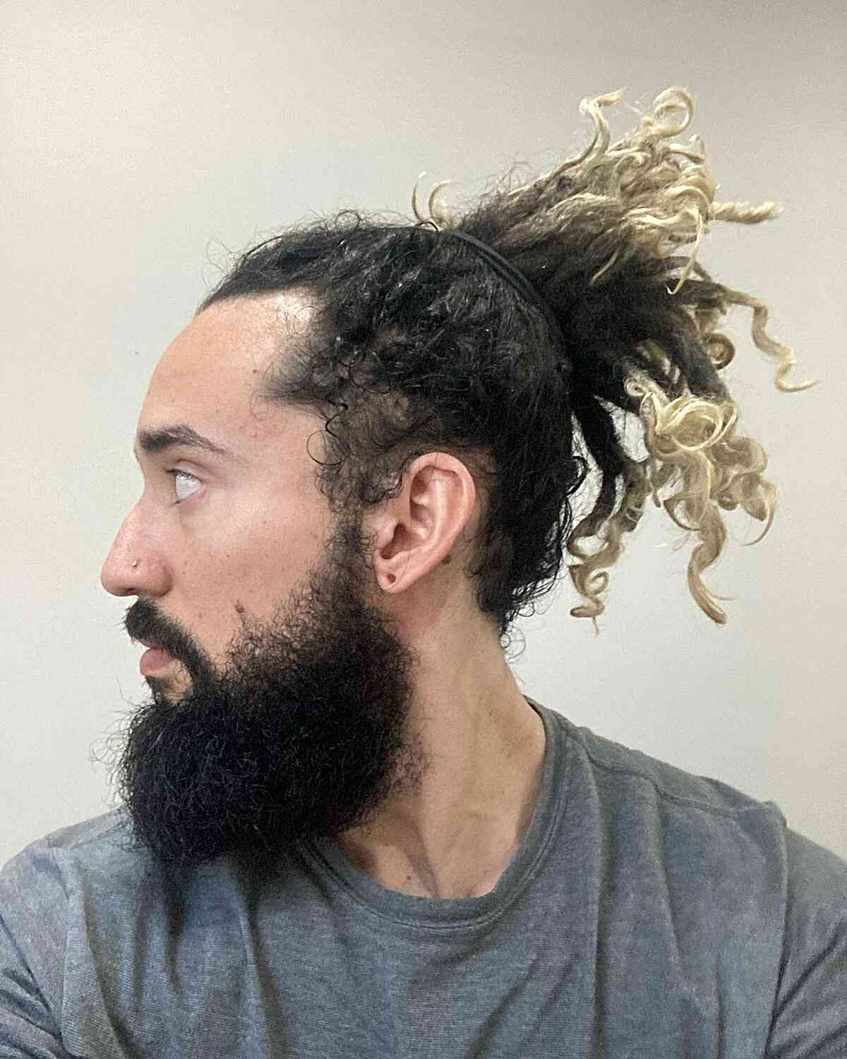 Freeform Dreads in a Ponytail for Men with Black Hair and Blonde Tips
