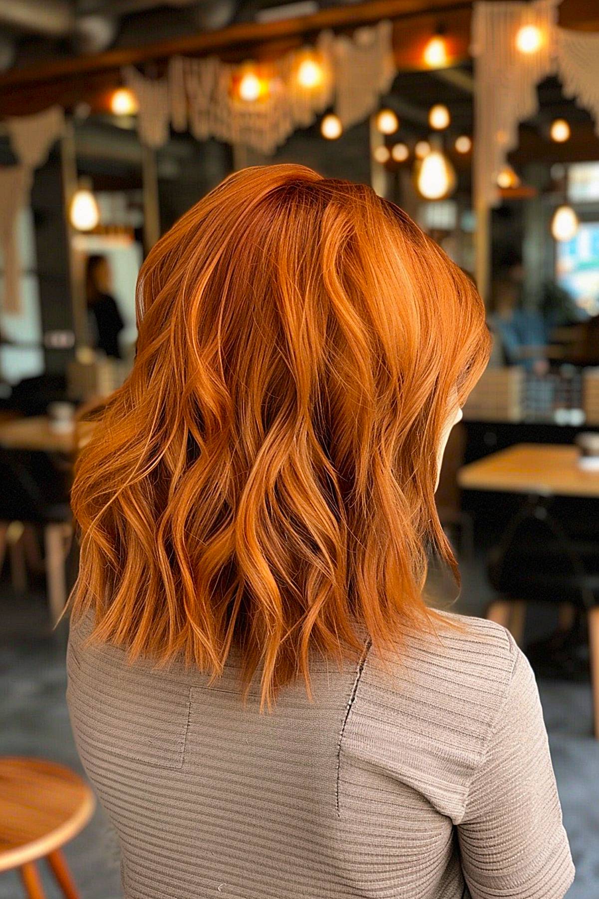 Freestyle bob with bold copper tones and textured waves