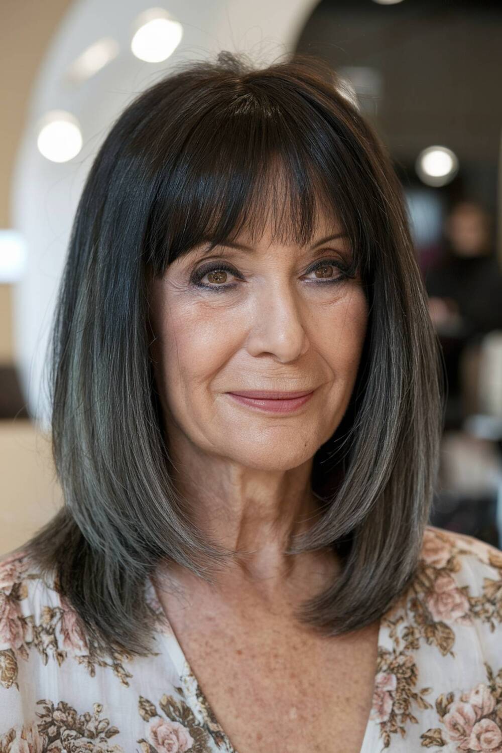 Classic French bob with wispy bangs, creating a soft and sophisticated look