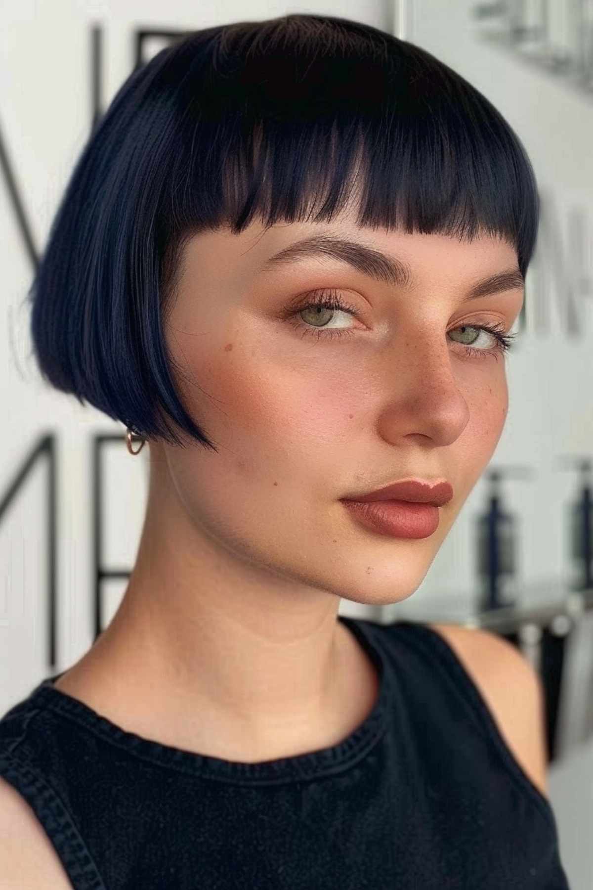 French bob with short bangs on a woman with fine to medium hair.