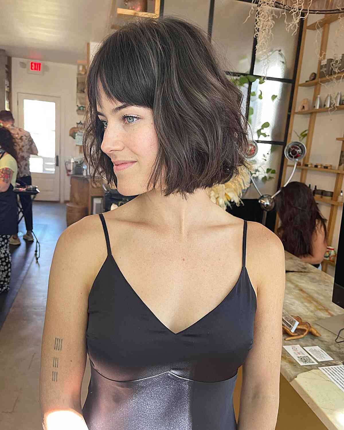 French-inspired Bob Cut with Curtain Fringe for women with a chic style