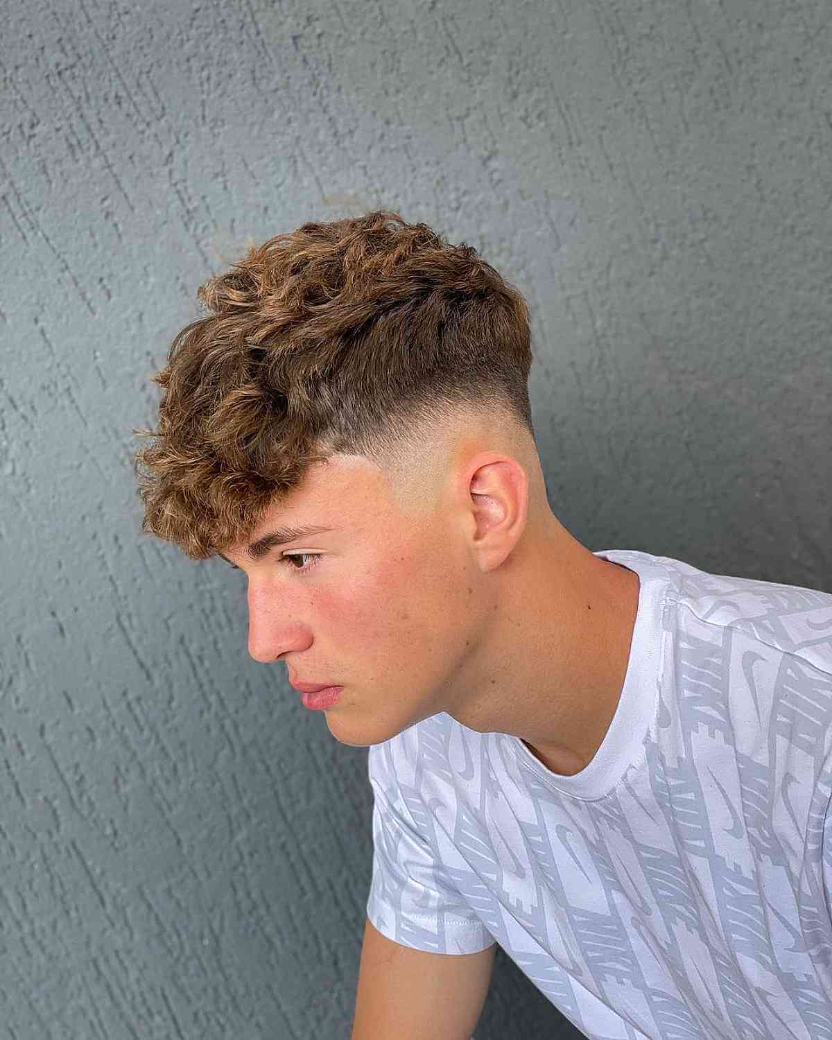 Fresh High Taper Fade for Men with Wavy Hair