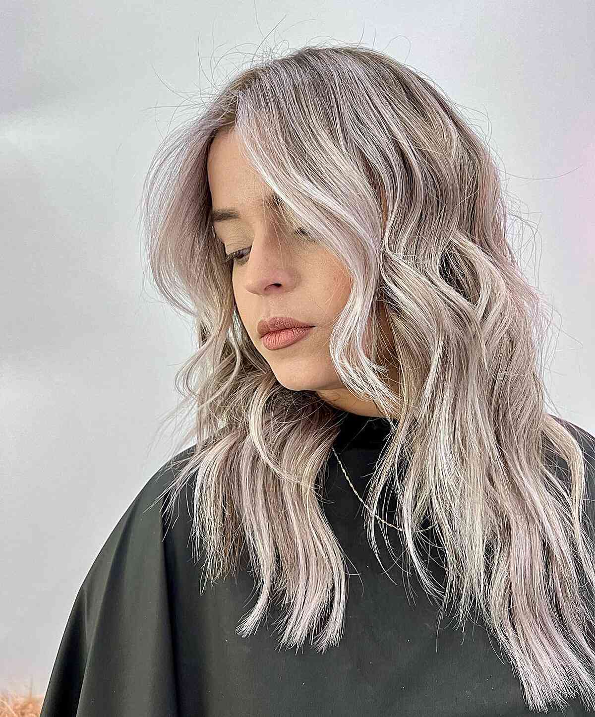 Medium to Long Frosted Icy Blonde Balayage Hair with Layered Waves