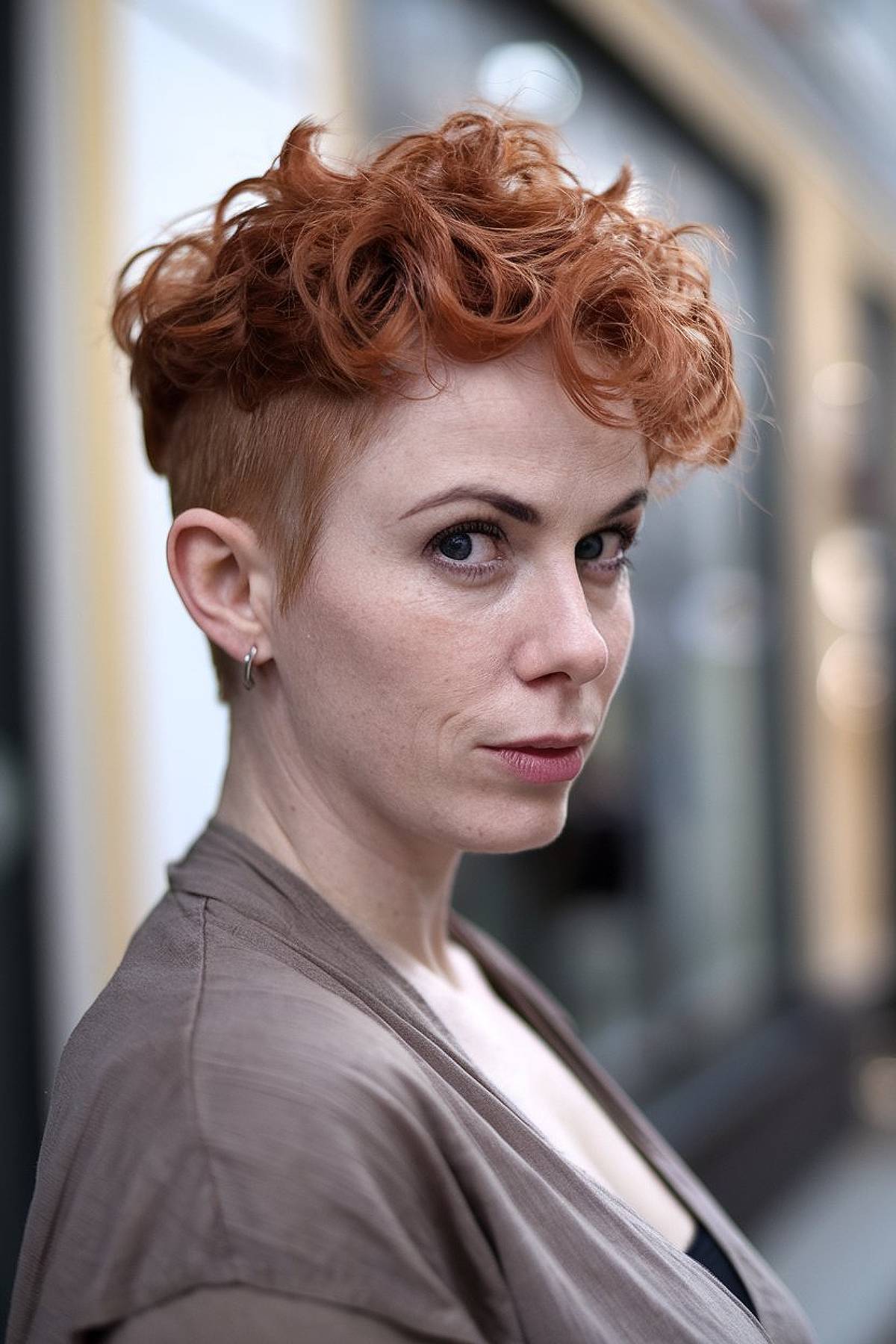 Funky curly pixie cut paired with an undercut