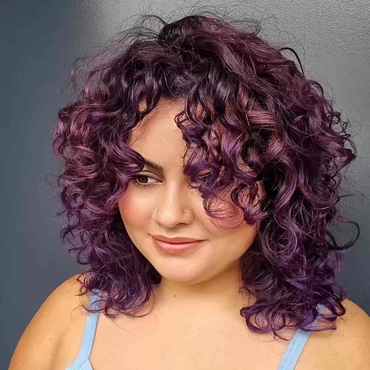 Funky Purple Curls for ladies with round faces and shoulder-length hair