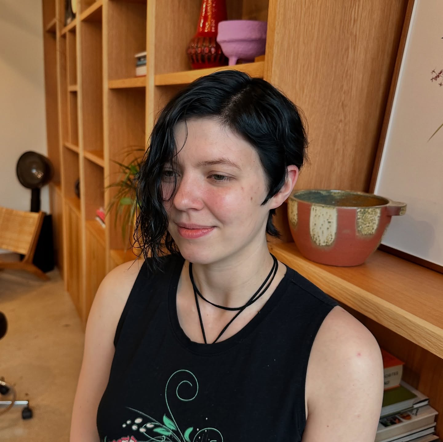 Sleek Black Asymmetrical Pixie with Subtle Waves