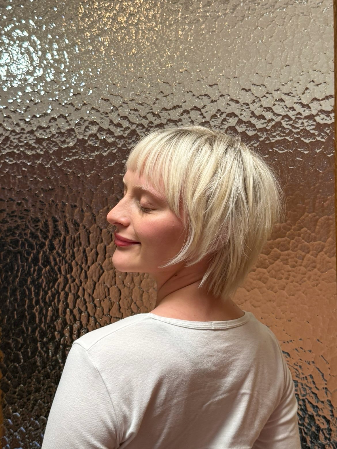Playful Platinum Textured Bob with Feathered Ends