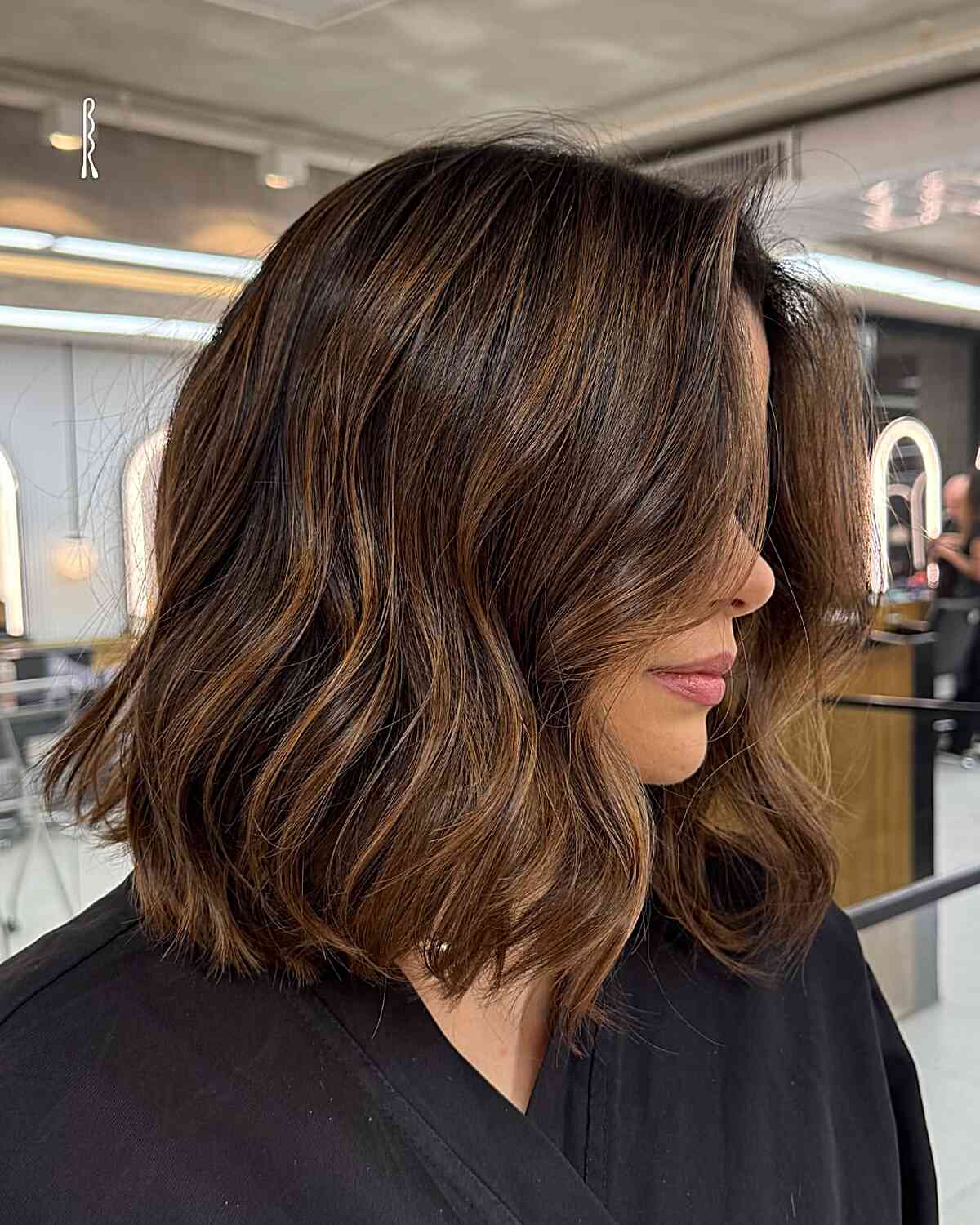 Textured Shoulder-Length Bob with Warm Highlights