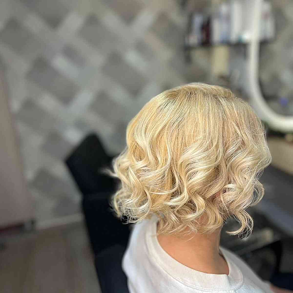 Textured Curly Bob with Light Blonde Highlights