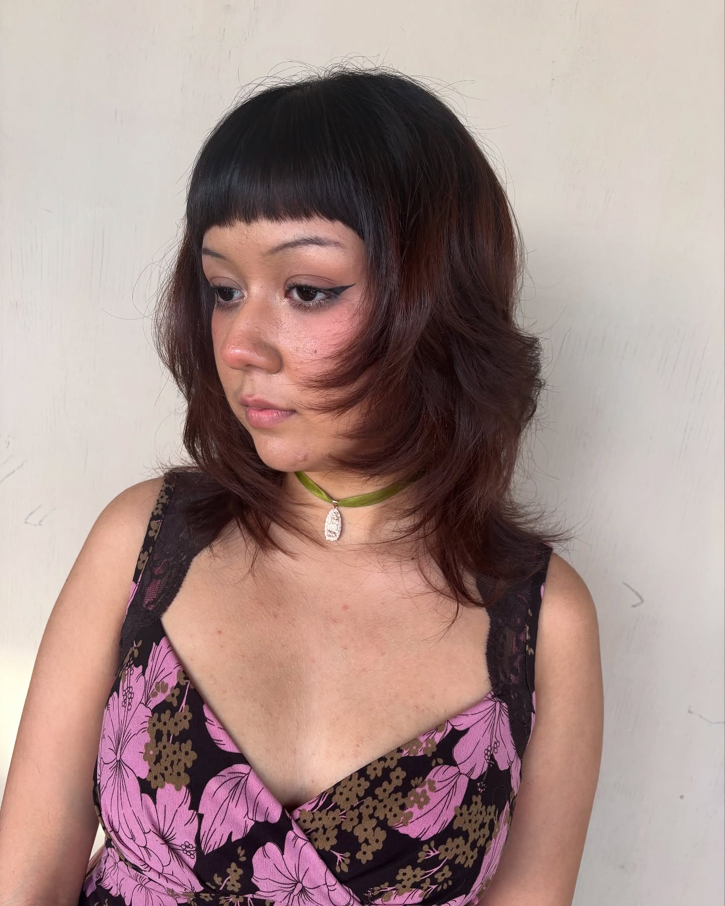 Chic Curly Lob with Bold Straight Fringe