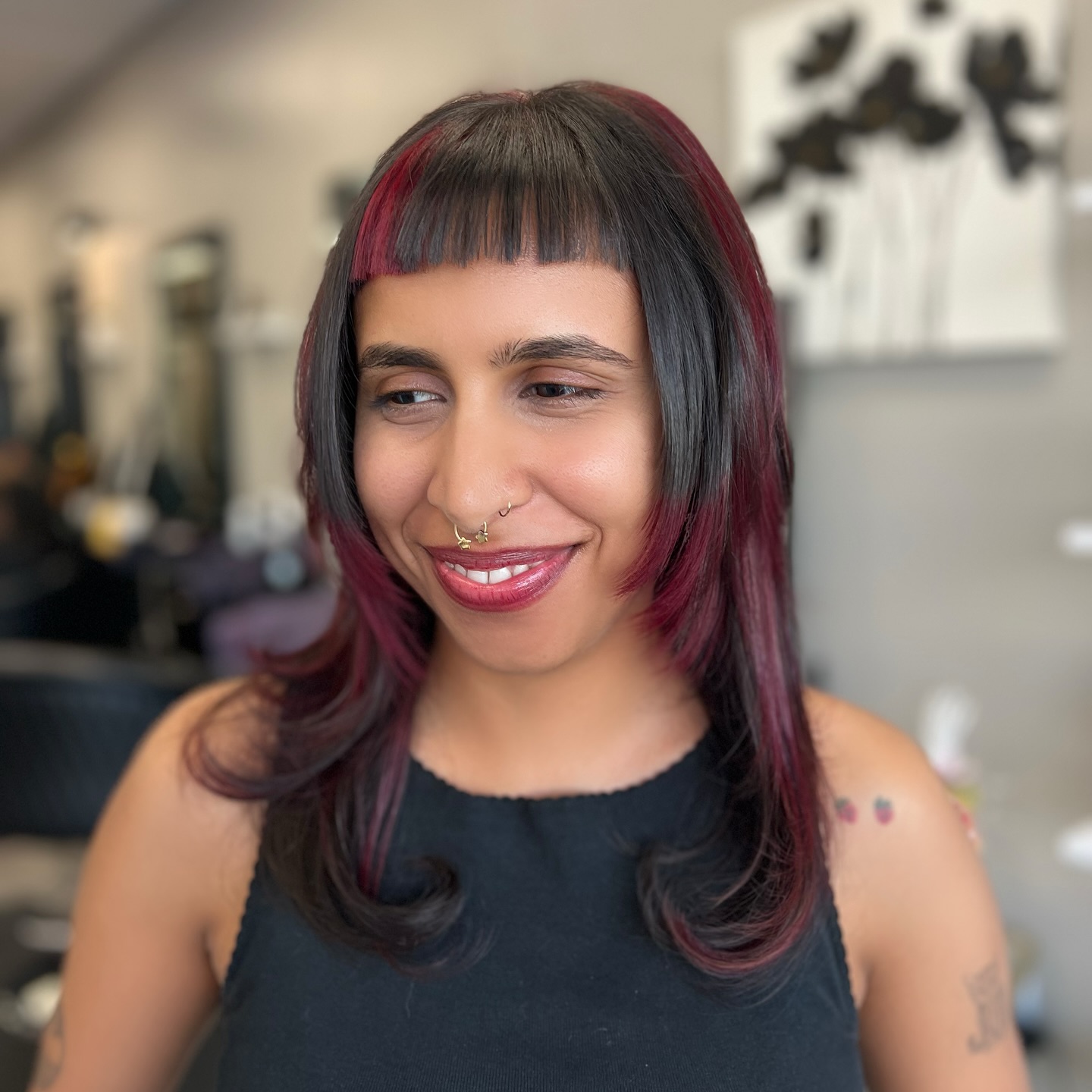 Chic Layered Cut with Bold Burgundy Highlights