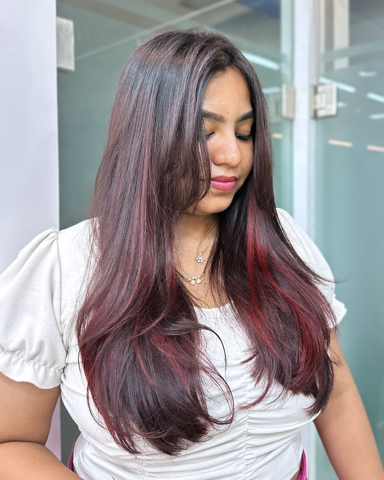 Chic Long Layers with Striking Red Highlights