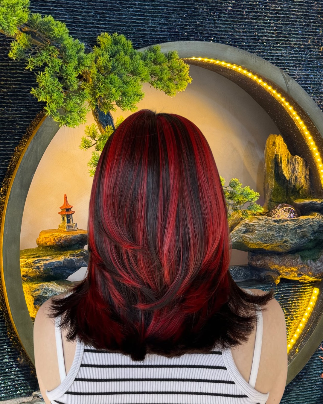 Dynamic Red Highlighted Lob with Subtle Layers