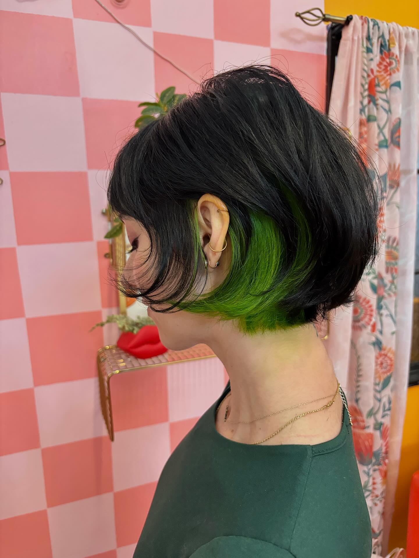 Edgy Black Bob with Bold Green Undercut