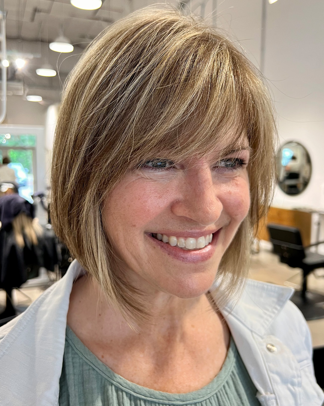 Golden-Beige Layered Bob with Wispy Bangs