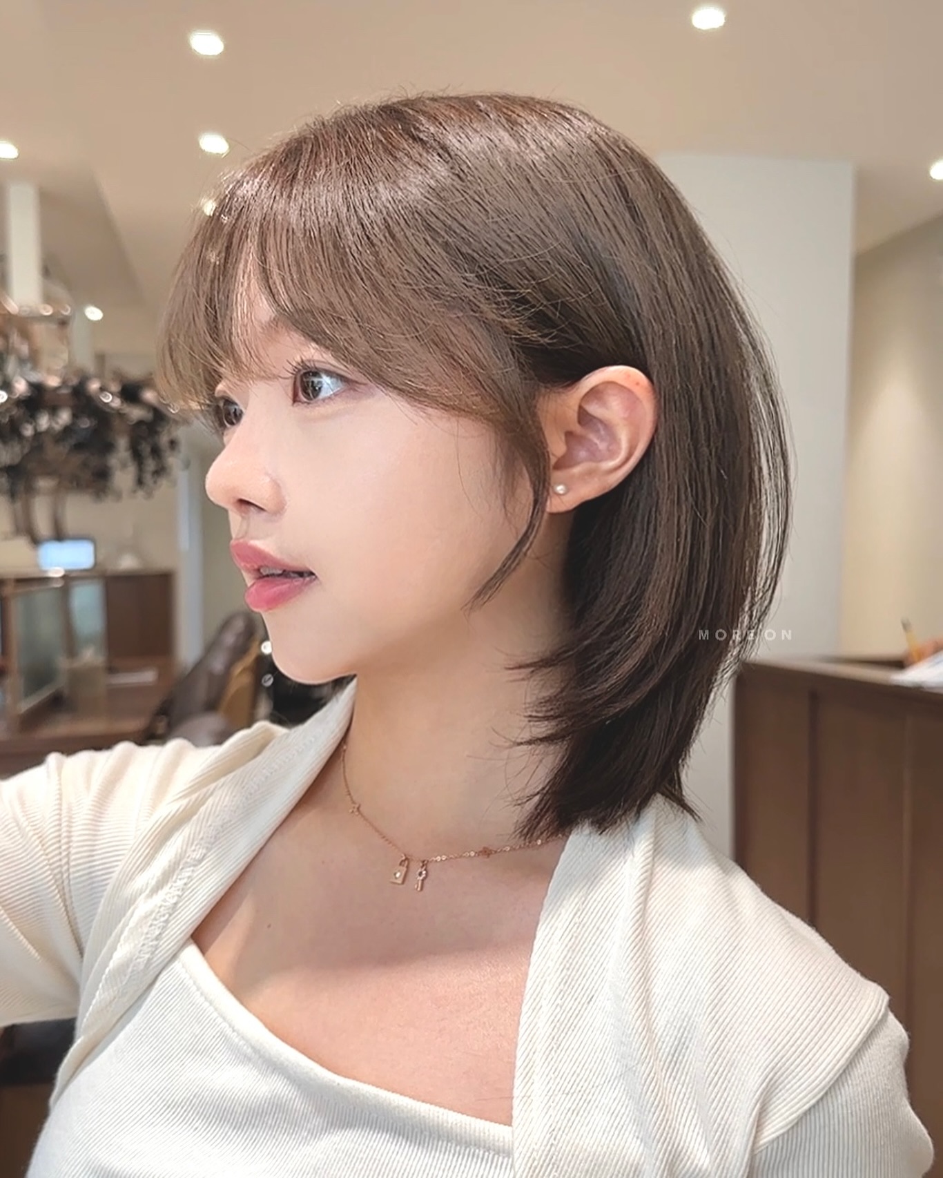 Sleek Ash-Brown Bob with Feathered Bangs