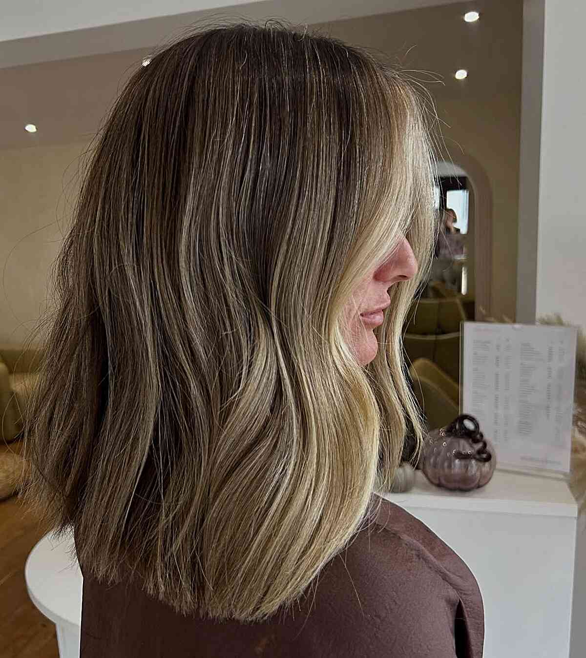 Stylish Medium Length Layered Hair with Blonde Highlights