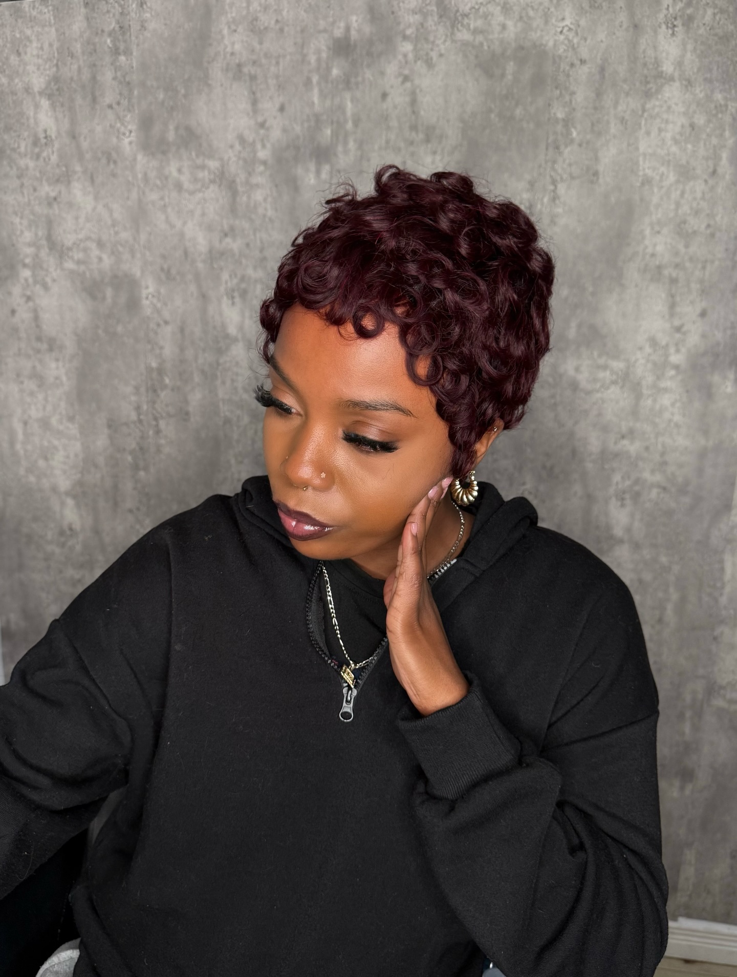 Burgundy Curled Pixie with Subtle Volume