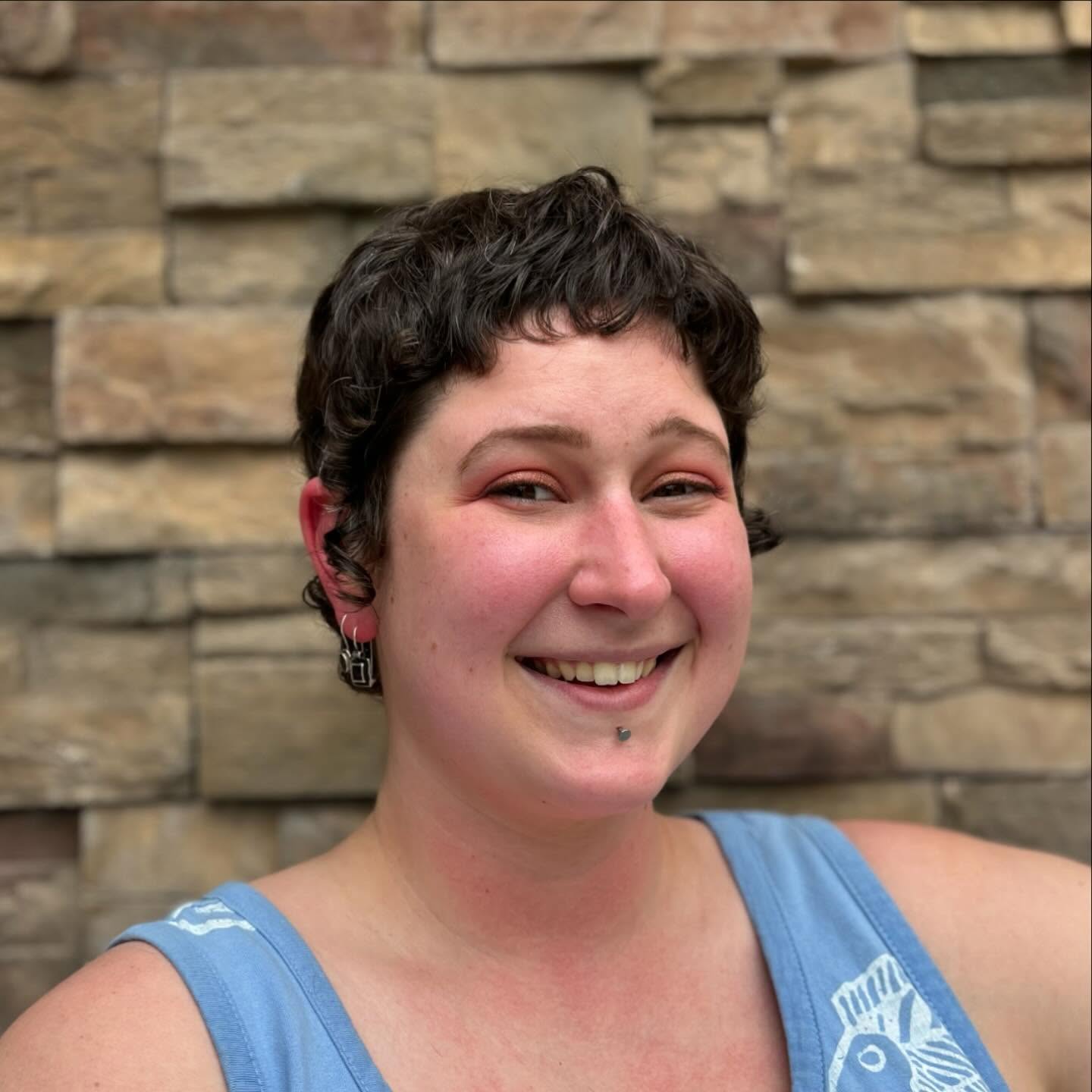 Softly Curled Brunette Pixie with Natural Volume