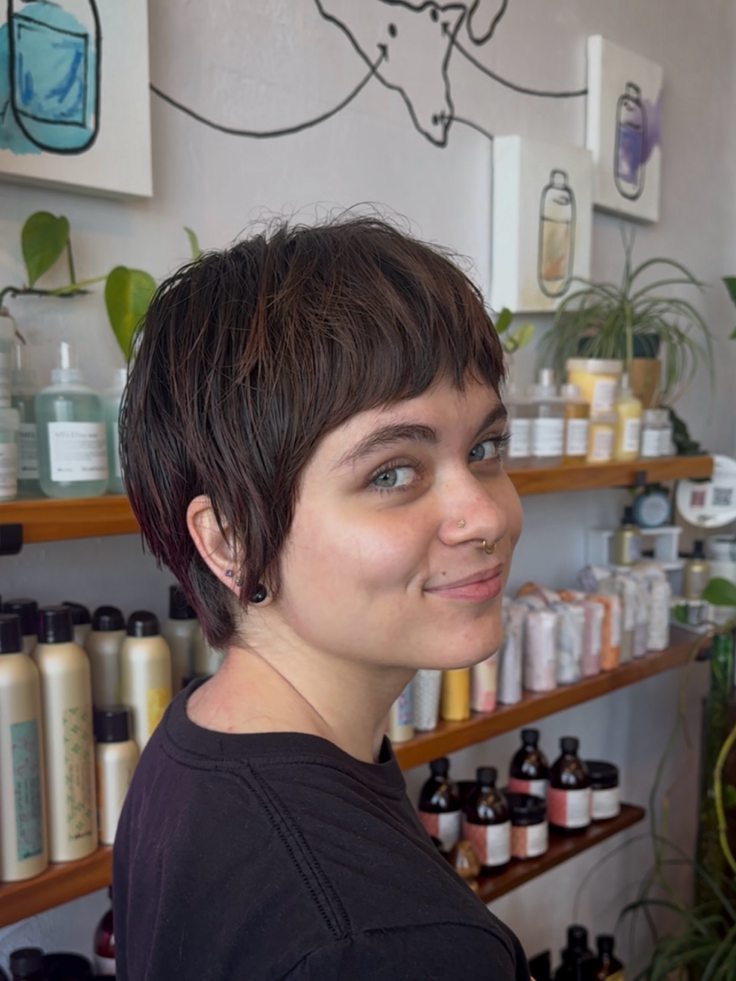 Captivating Charcoal Pixie Mullet with Brow-Sweeping Bangs