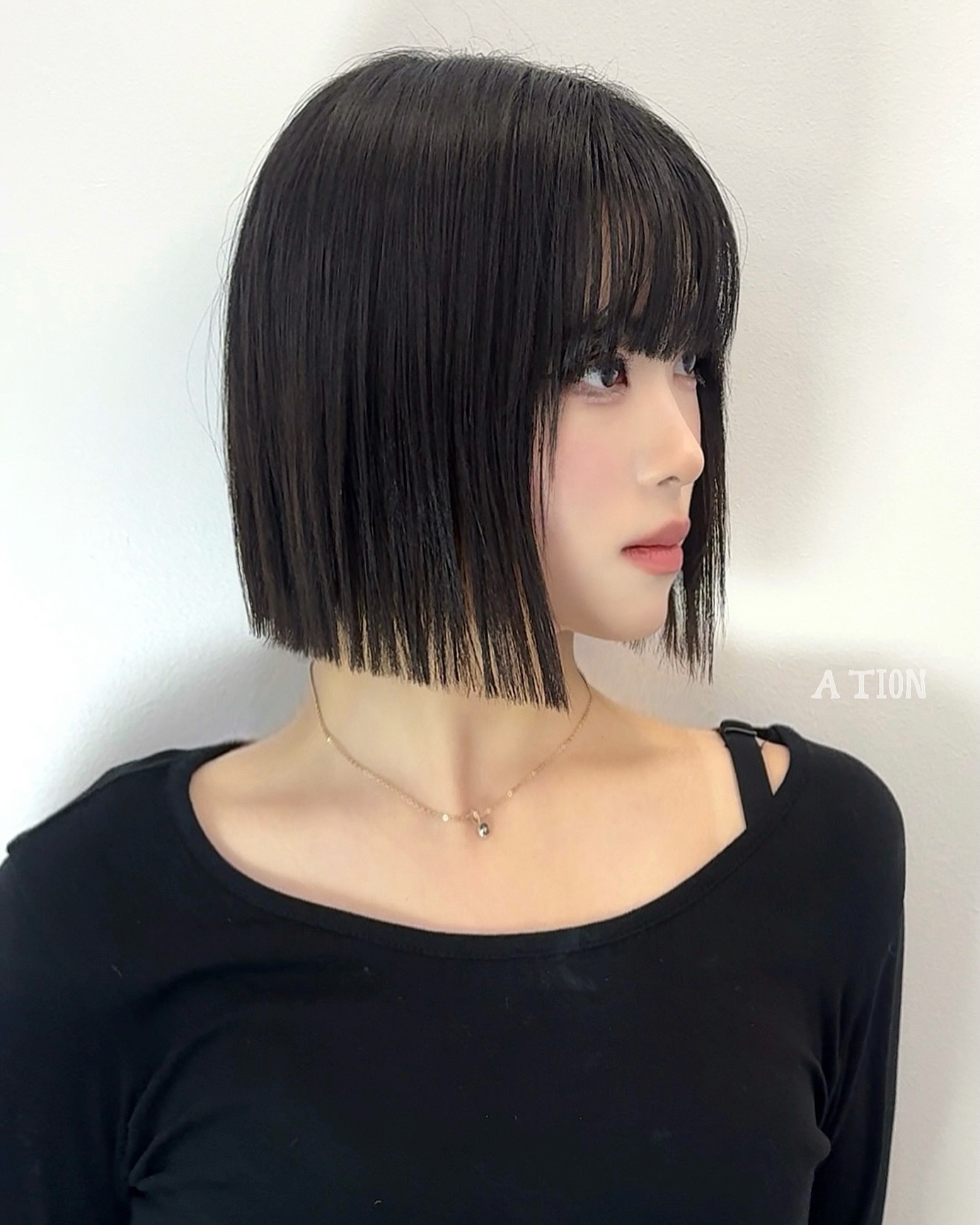 Sleek Jet-Black Bob with Precise Bangs