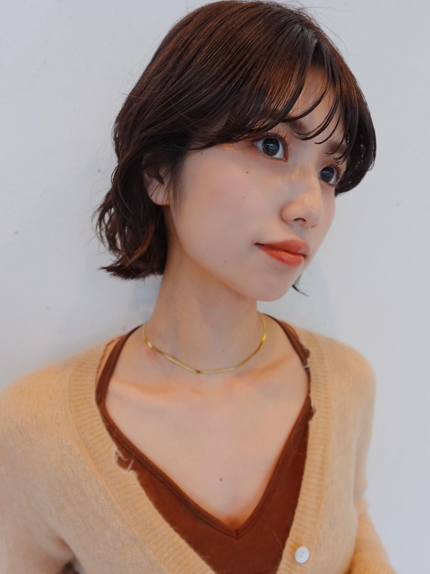 Softly Textured Wavy Bob with Delicate Bangs