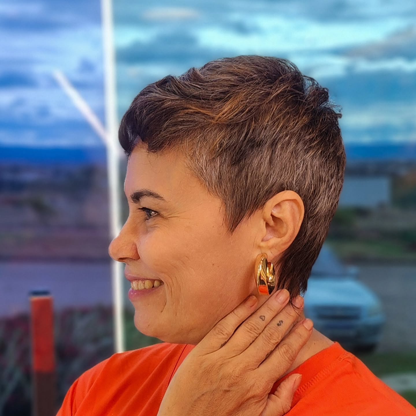 Brunette Layered Pixie with Side-Swept Bangs