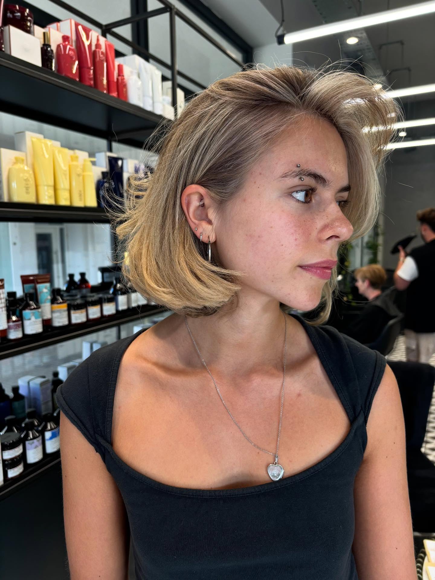 Dynamic Ash Blonde Layered Bob with Natural Highlights