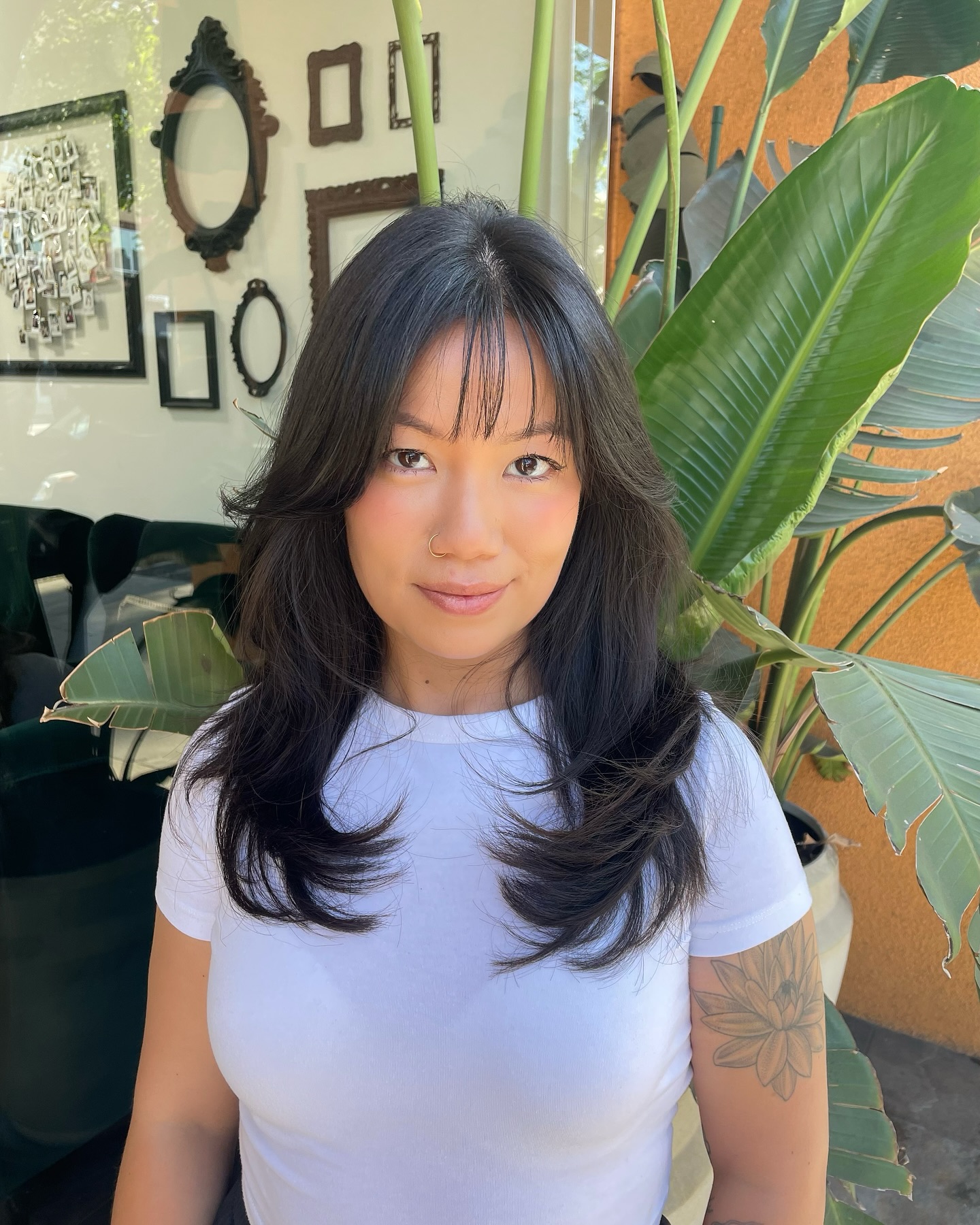 Effortless Ebony Waves with Delicate Wispy Bangs