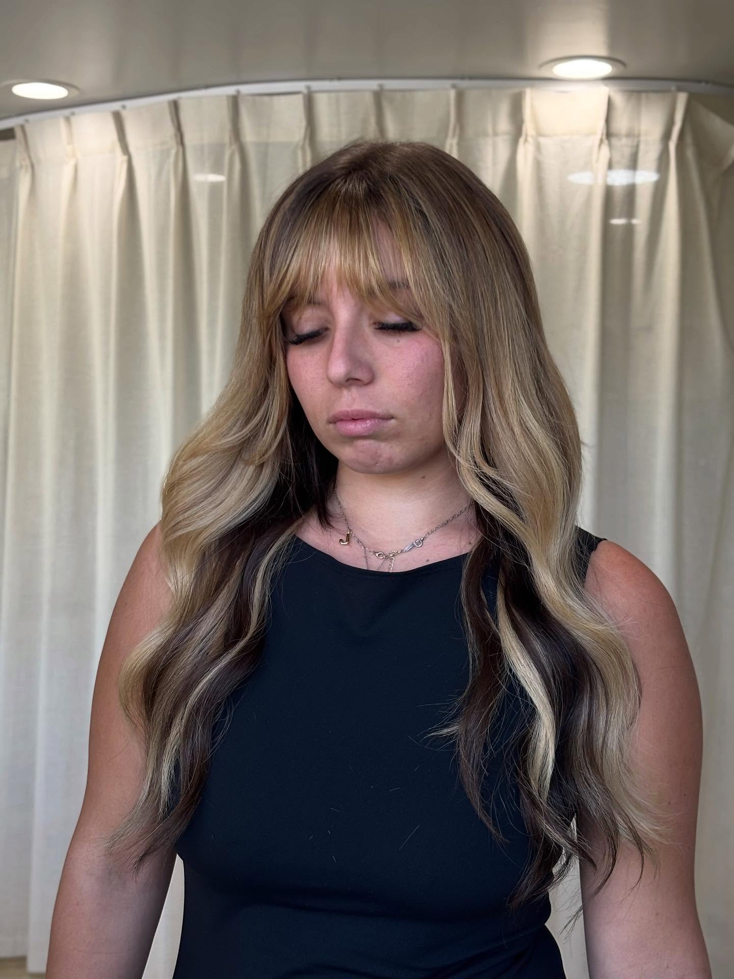 Light Caramel Balayage with Face-Framing Wispy Bangs