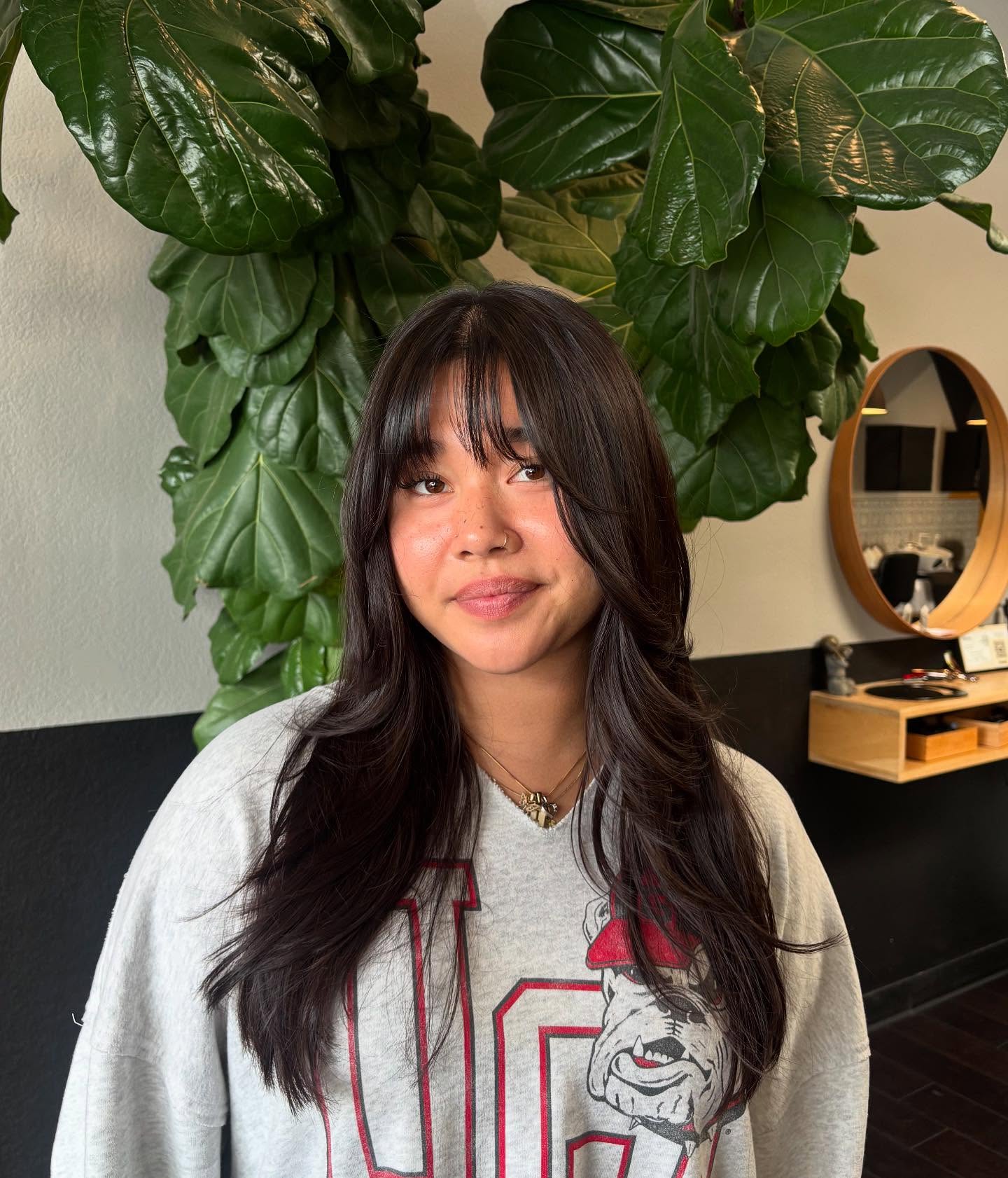 Relaxed Chestnut Layers with Feathered Wispy Bangs