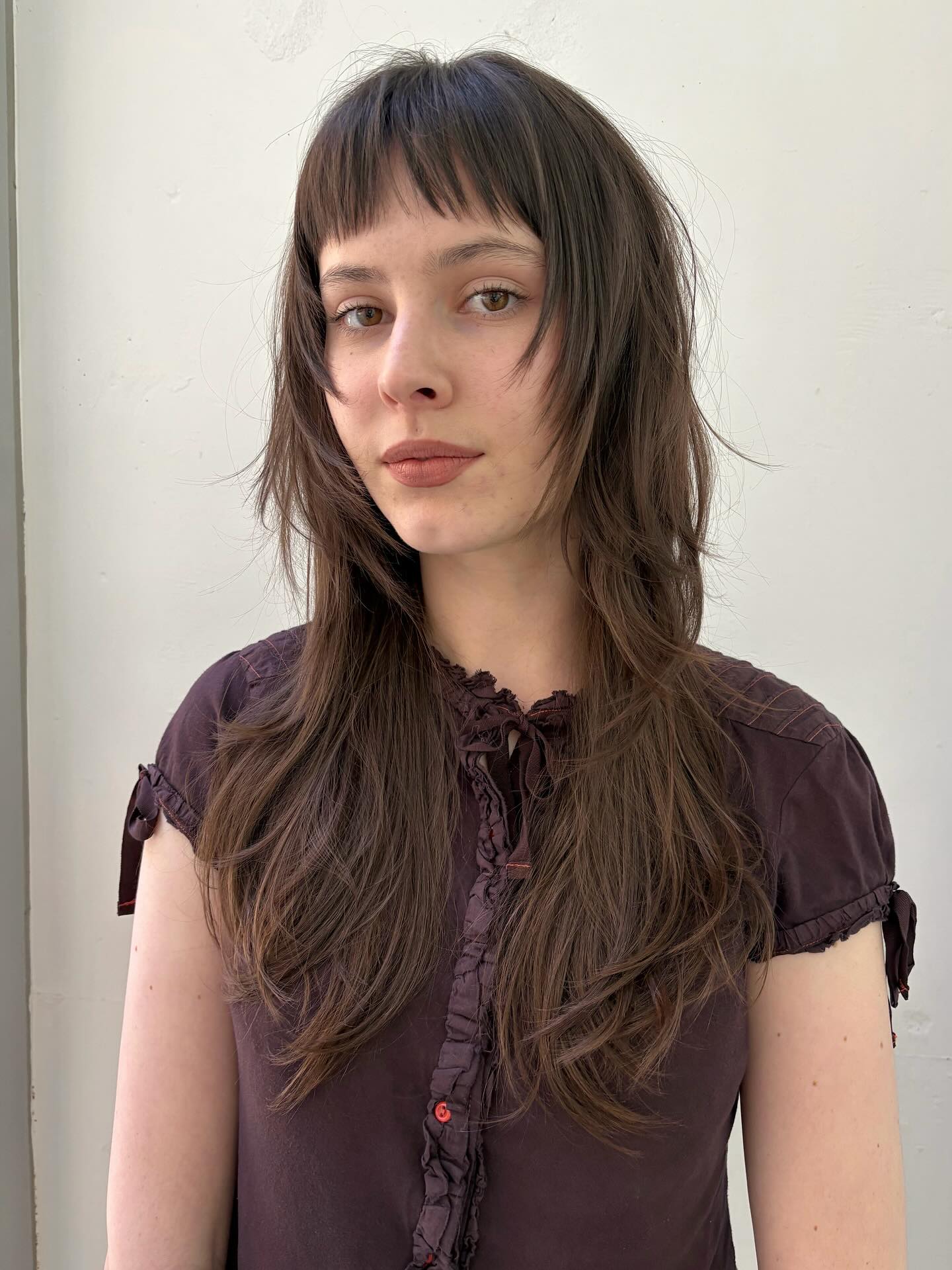 Subtle Chocolate Tresses with Wispy Fringe