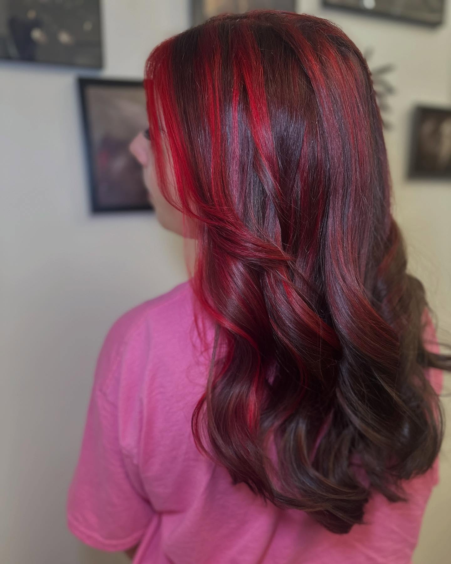 Bold Red Highlights on Luscious Brown Waves