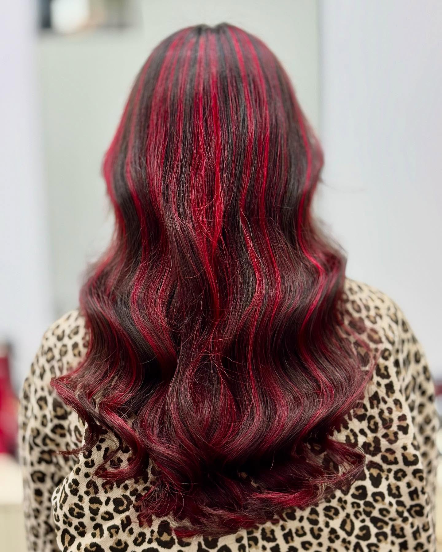 Bold Red Streaks on Flowing Brown Waves
