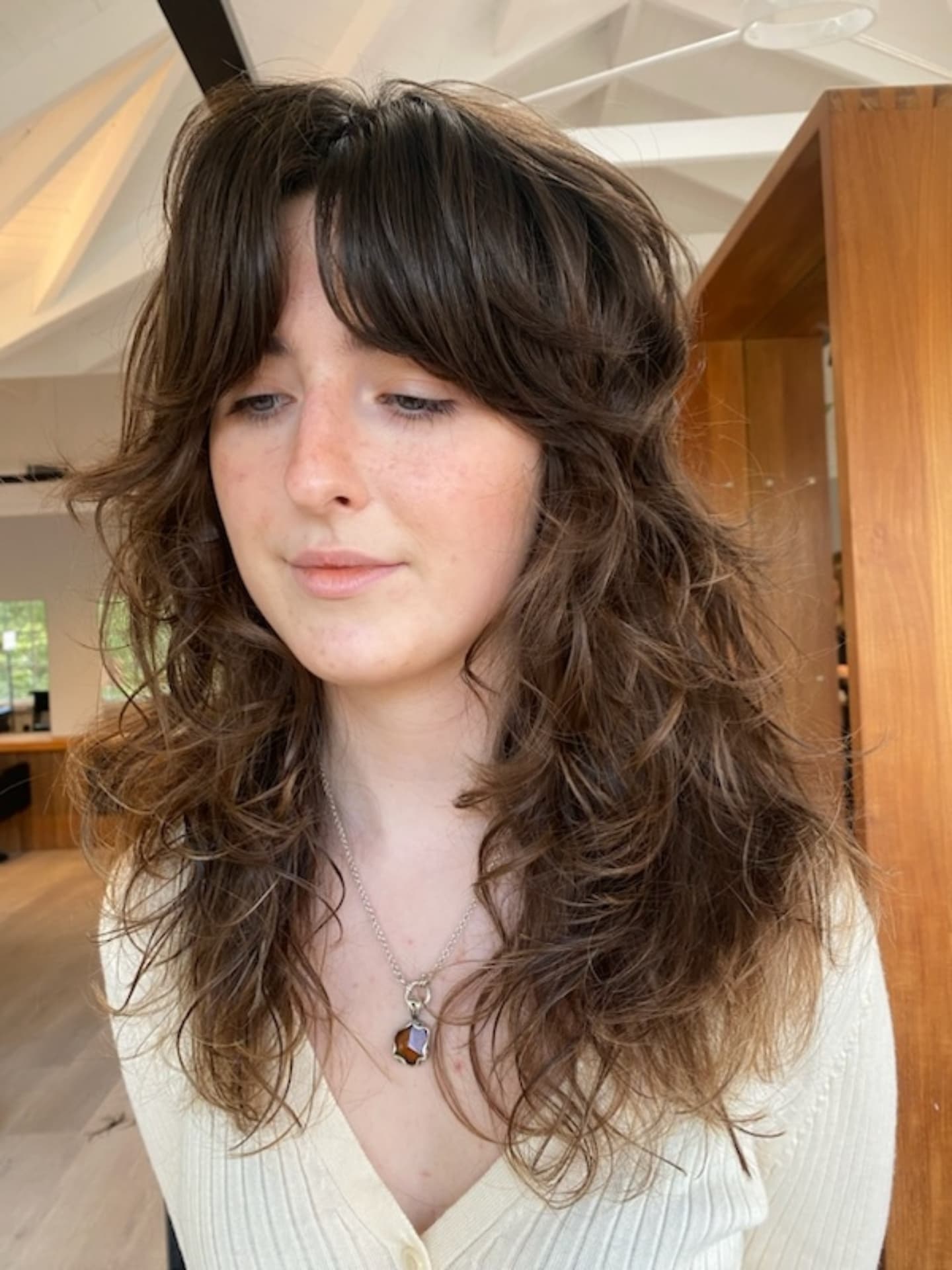 Brunette Tousled Waves with Soft Curtain Bangs